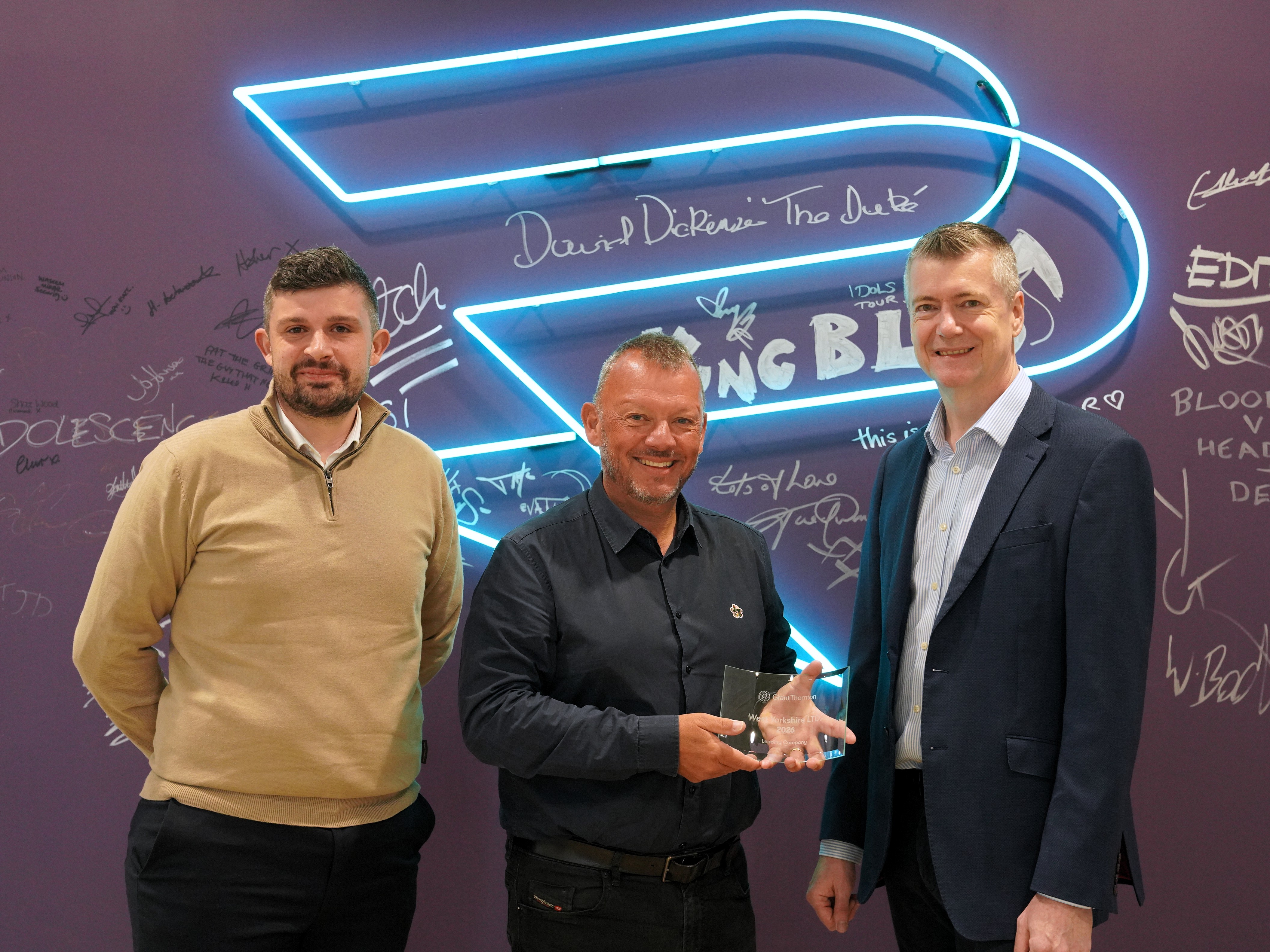 Members of Grant Thornton handing award to Jim Farmery of Production Park 